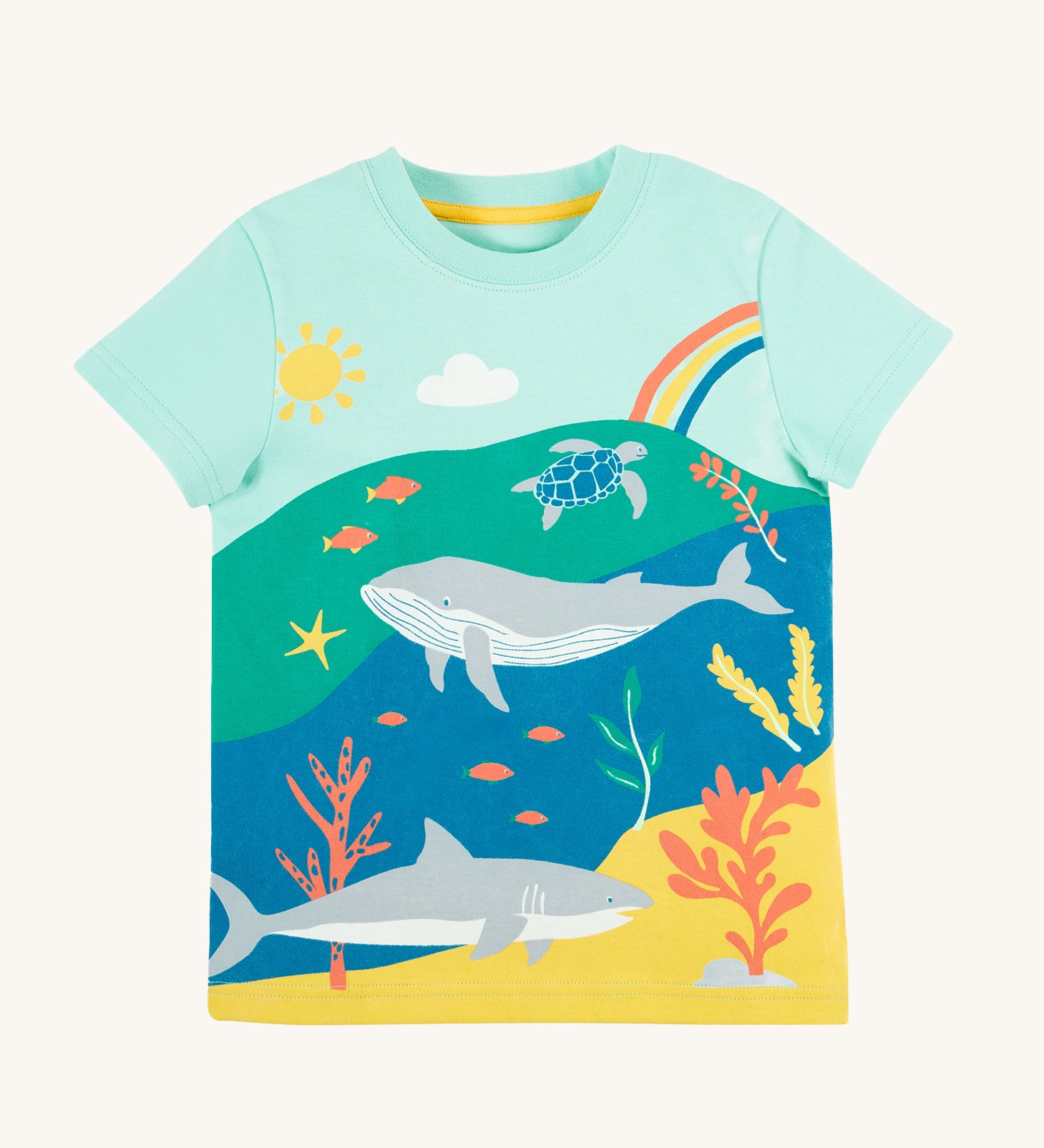Frugi Iori Printed T-Shirt in Spring Mint laid flat, featuring a colourful Sea Life Scene which includes wales, sharks and other smaller fish, with the sun and a rainbow.