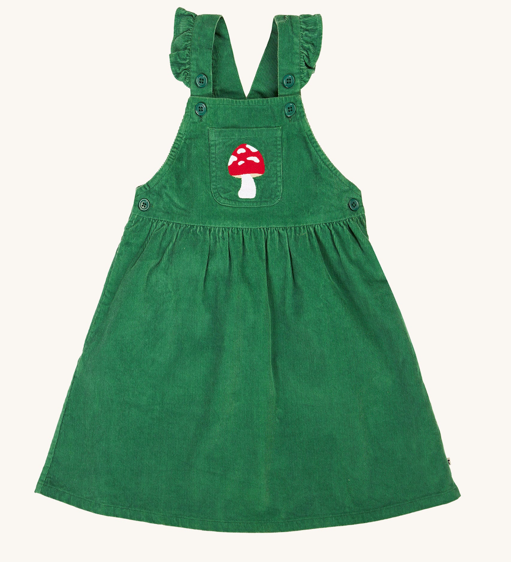 Frugi kids isla dugaree dress in holly green/mushroom available at Babipur. A 100% GOTS organic cotton dungaree dress in a green corduroy colour. Features a mushroom embroidery on a small front pocket, button fasteners and frilled shoulder straps.