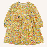 Frugi Izzie organic cotton jersey dress with highland houses print on a yellow background. Elasticated arm cuffs and button up front closure.