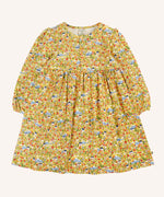 Frugi Izzie organic cotton jersey dress with highland houses print on a yellow background. Elasticated arm cuffs and button up front closure.