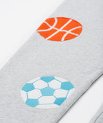 Close up of the Frugi kids jack appliqué joggers. Showing the football and basketball appliqué on grey organic cotton fabric