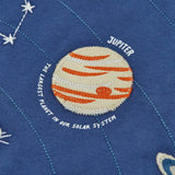 Close up of the Jupiter planet applique on the front of the Frugi Jake long sleeved applique top in navy blue.