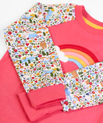 Frugi GOTS 100% organic cotton kids pyjama in pink and white with floral sleeves and fold down cuffs for extender wear