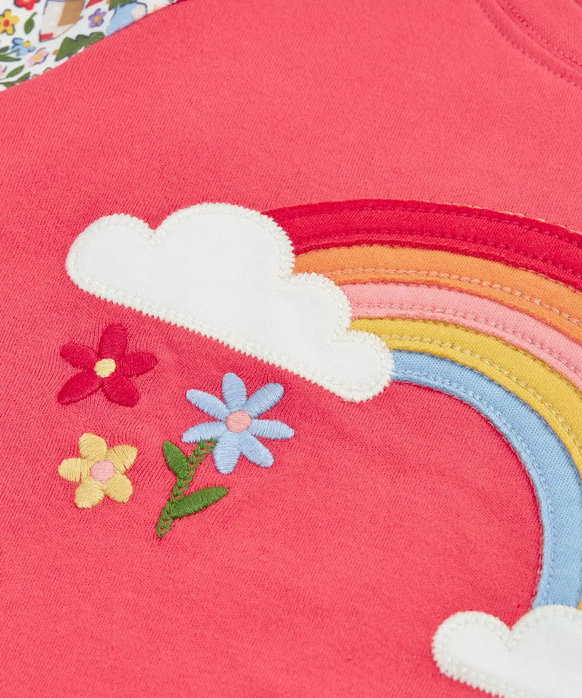 Frugi GOTS 100% organic cotton kids pyjama top in pink showing a close up of the rainbow and clour applique on the front