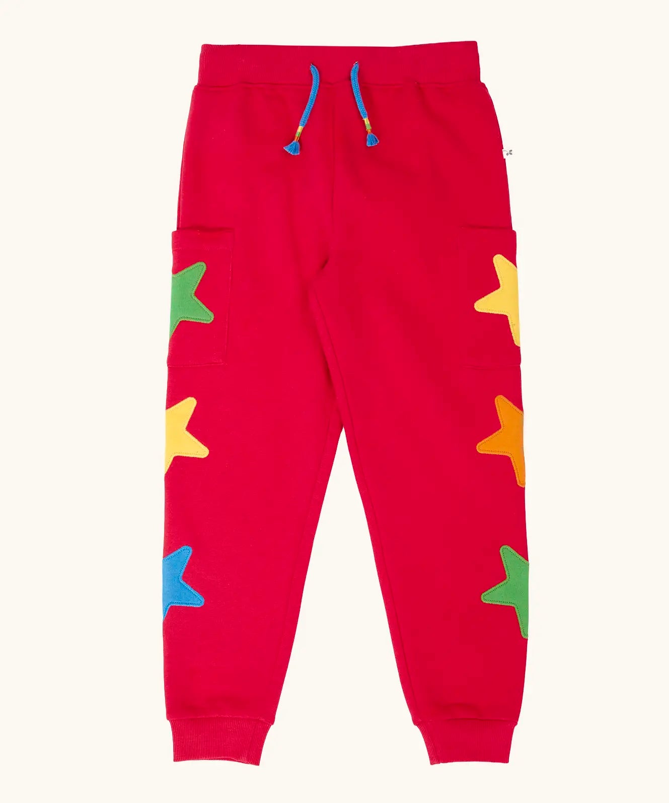 Frugi journey joggers in scarlet red with three stars appliques on each side.