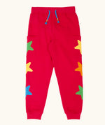 Frugi journey joggers in scarlet red with three stars appliques on each side.