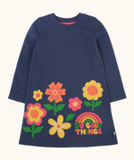 Frugi Kari long sleeved dress in navy with flowers and do good things rainbow slogans along the hemline.