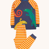 Frugi gecko orange breton stripe organic cotton kids pyjamas. A navy long sleeved top with orange breton striped sleeves with geckos on the front and matching breton striped trousers.  