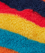 A close up o the Frugi kids recycled cosy snuggle suit in autumn stripe showing the stripe design detail on fleece style recycled fabric.