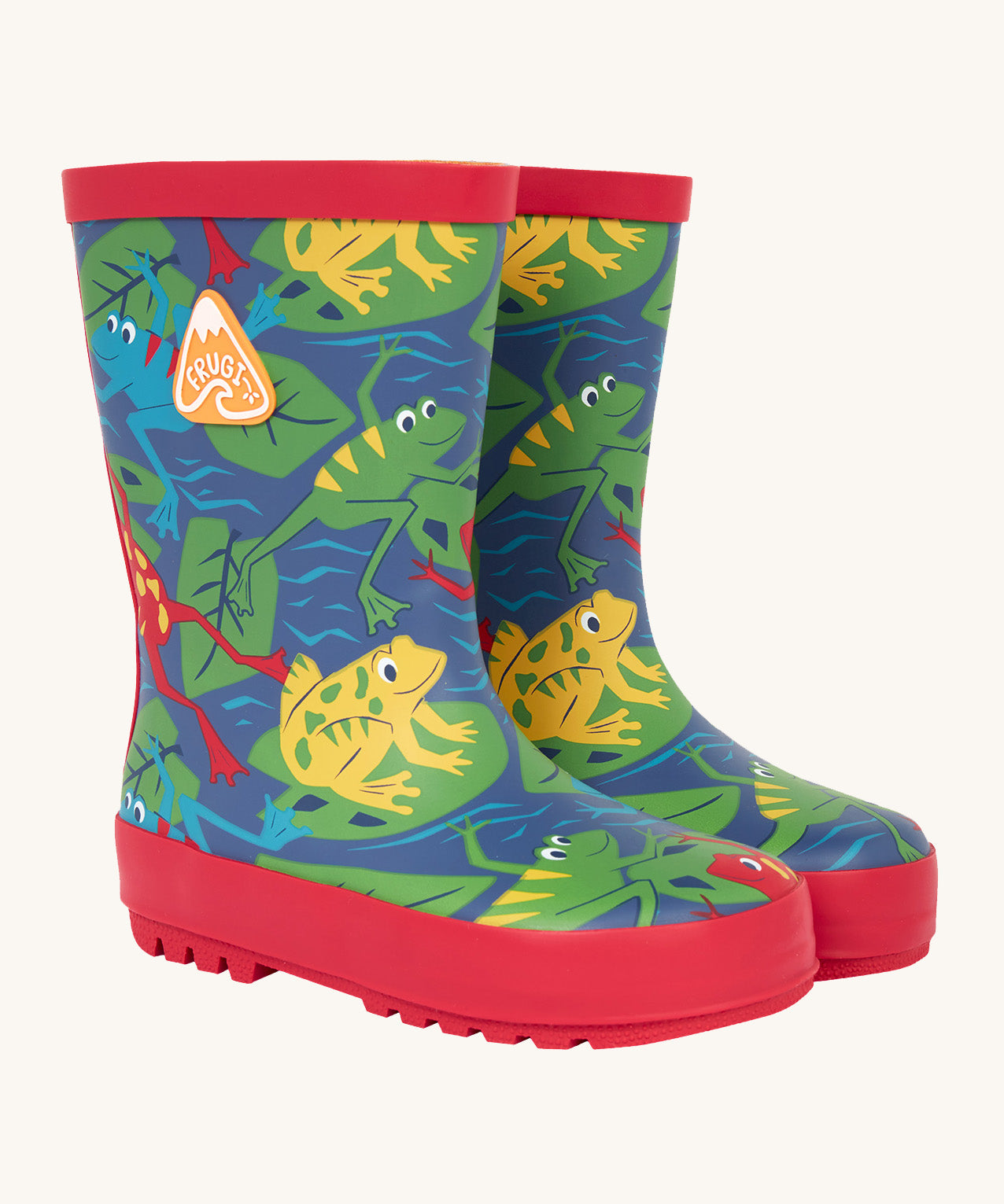 Frugi kids puddle buster wellington boots in be hoppy design. A natural rubber, waterproof navy wellington with red trim . Features multiple playful prints of multicoloured frogs on Lilly pads