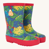 Frugi kids puddle buster wellington boots in be hoppy design. A natural rubber, waterproof navy wellington with red trim . Features multiple playful prints of multicoloured frogs on Lilly pads
