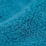 A close up of the Frugi bude boat blue fleece gilet showing the turquoise fleece  detail