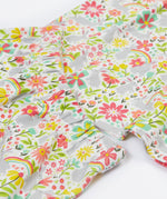 Close up of the Frugi bunny bounce fawn pyjama set showing the elasticated waist band detail on the shorts on top of the t-shirt. Featuring a grey bunny with floral print design on organic cotton fabric
