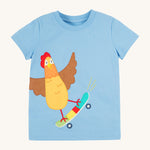 Frugi kids cornflower blue chicken t-shirt. GOTS organic cotton kids t-shirt in light blue and short sleeves. Features an appliqué of a brown chicken standing on a skateboard.