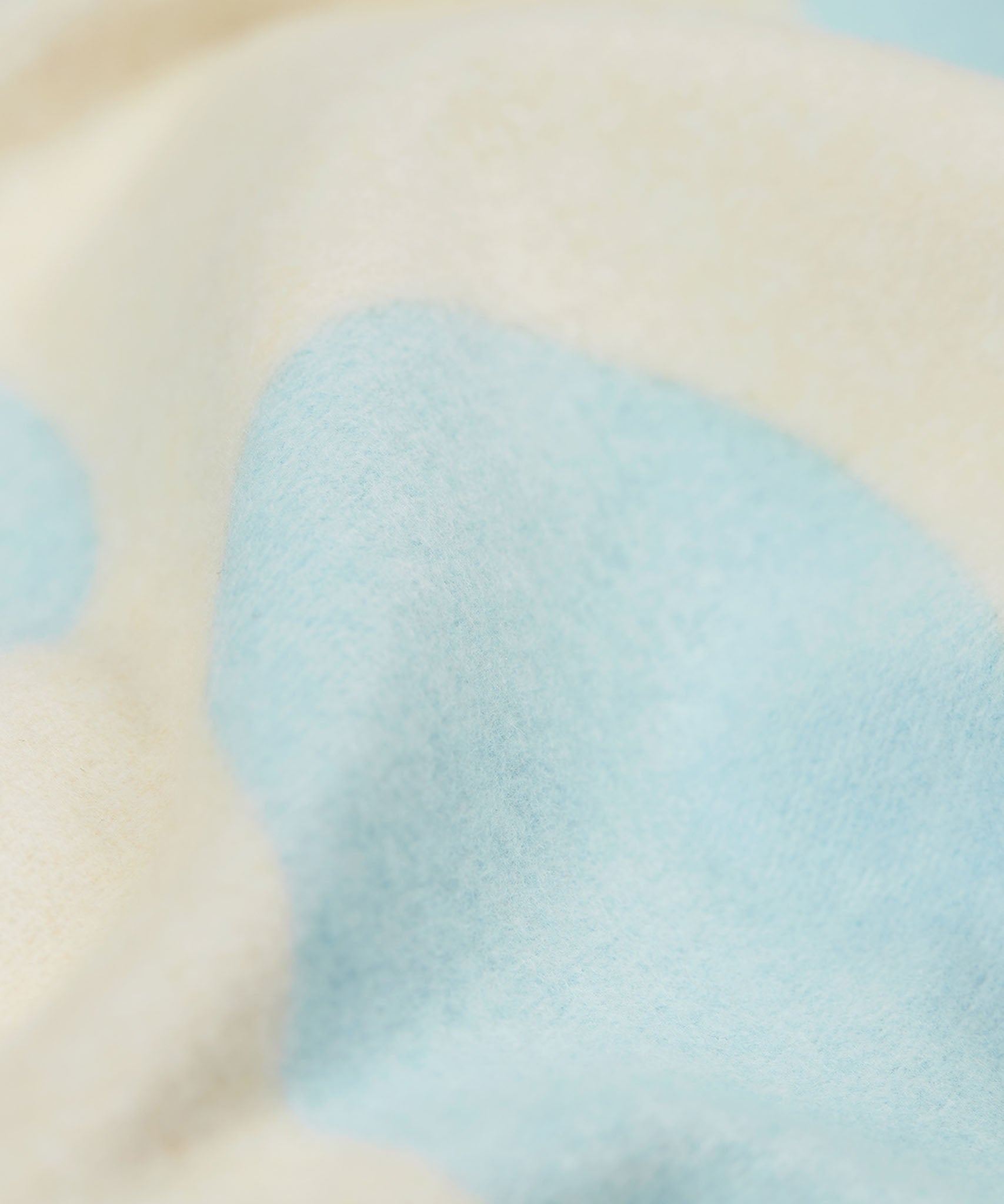A close up of the Frugi kids cosy flared leggings in super spot showing the brushed fleece inner liner.