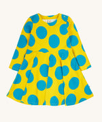 Frugi cosy skater dress in super spot available at Babipur. A 100% GOTS organic cotton skater dress in yellow with long sleeves and bold blue circle prints/ Features popper fasteners on the shoulder.