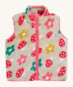 The removable  fleece gilet from the Frugi 3 in 1 dragon / mushroom rambler waterproof coat. A thick warm fleece with a full length zip in cream with a red mushroom design and pink trim