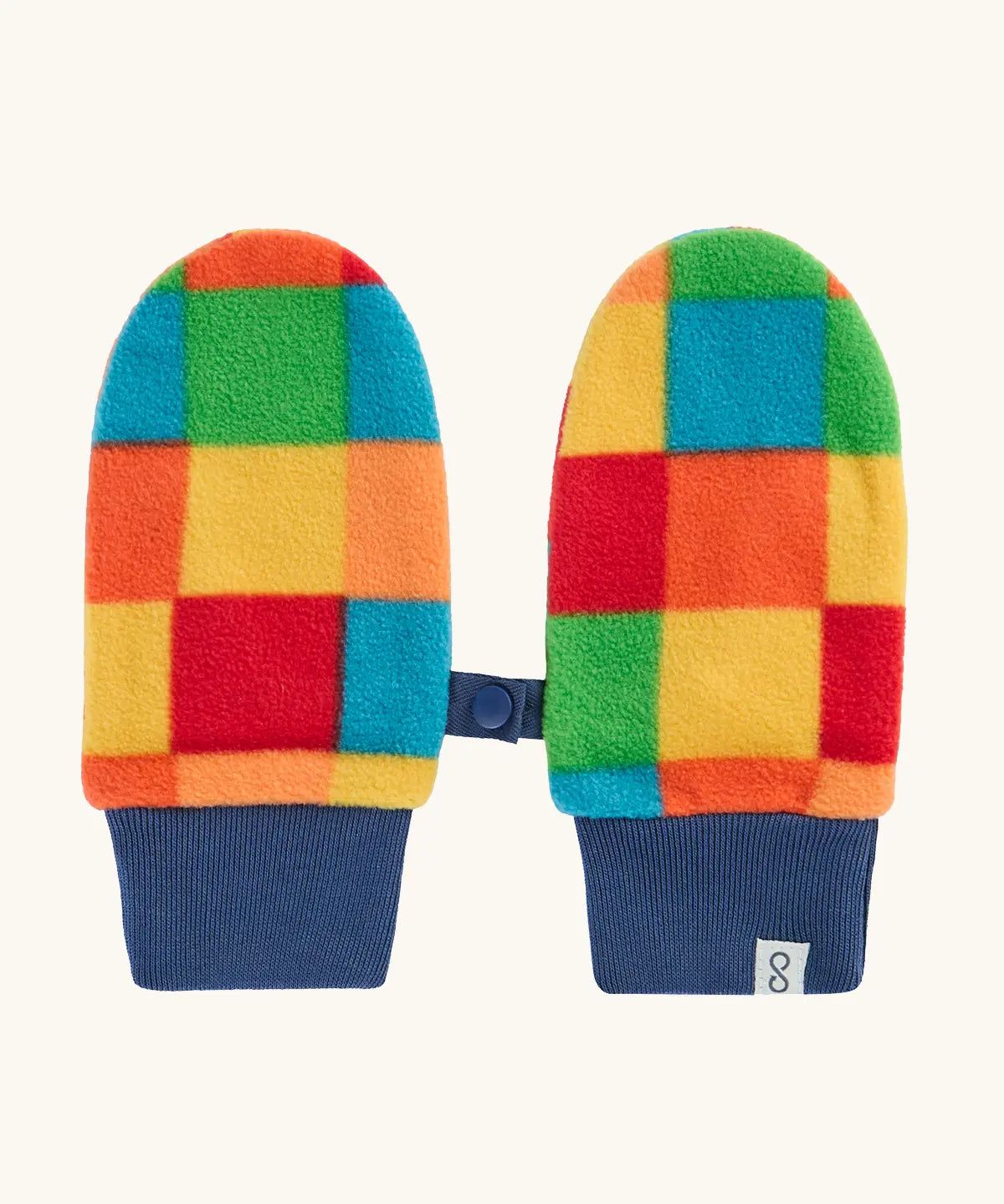 A pair of colorful fleece mittens with a patchwork pattern of red, orange, yellow, green, and blue squares, finished with navy blue ribbed cuffs and a small strap detail.