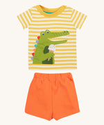 Frugi kids easy wrap around crocodile outfit. GOTS organic cotton Frugi kids outfit with a yellow and white stripe, short sleeve t-shirt, yellow neck trim and orange short. Features a crocodile eating a ice applique on the front of the t-shirt
