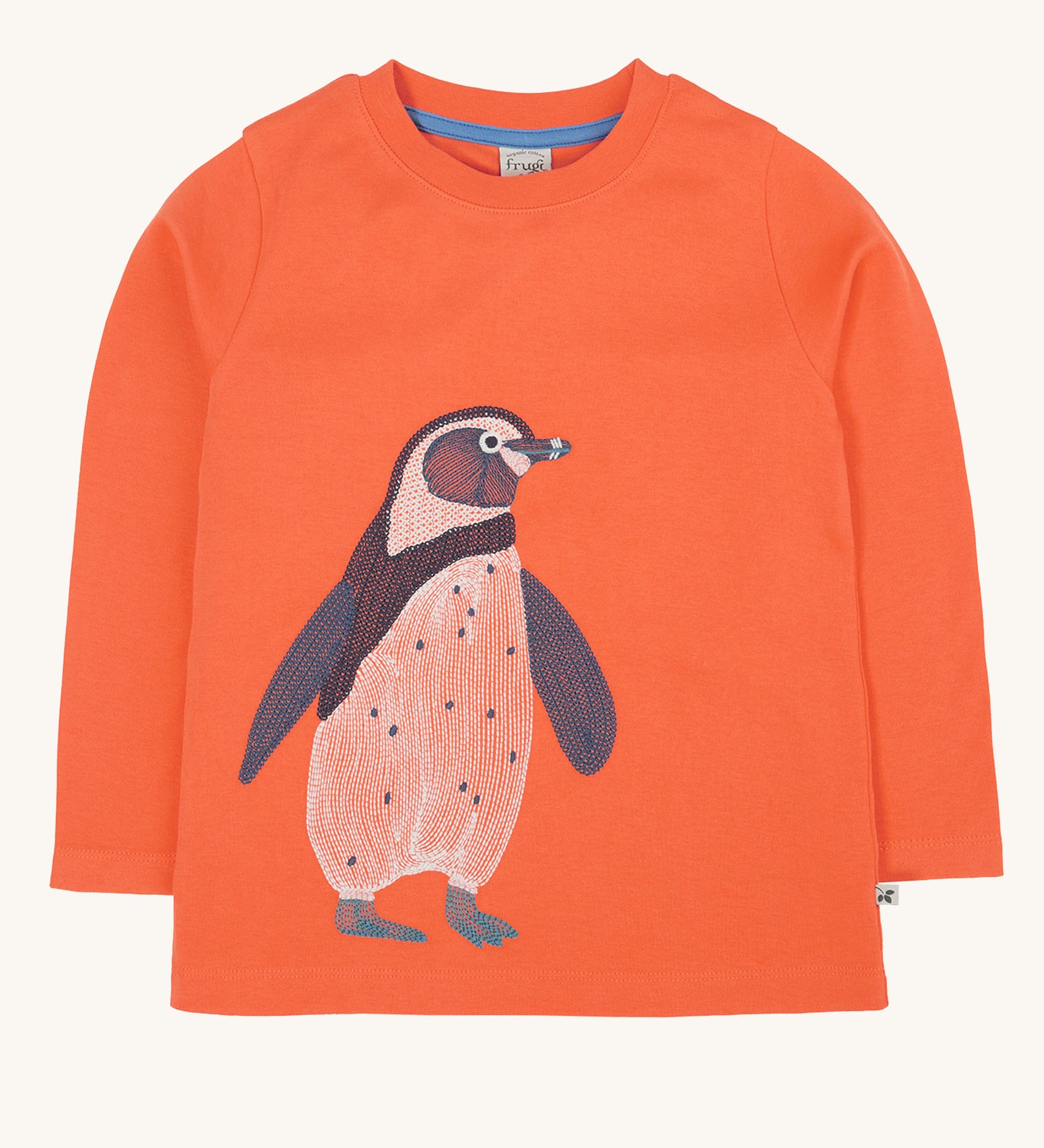 Frugi kids emroidered adventure top in salamander/penguin available at Babipur. A GOTS organic cotton top in pastel orange with a cute penguin embroidery on the front.