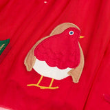 Close up of the robin applique on the  red tulle skirt of the Frugi emmie skater dress.