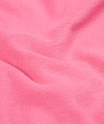 A close up of the pink fleece inside liner on the fun flowers Frugi puddle buster coat for warmth. 