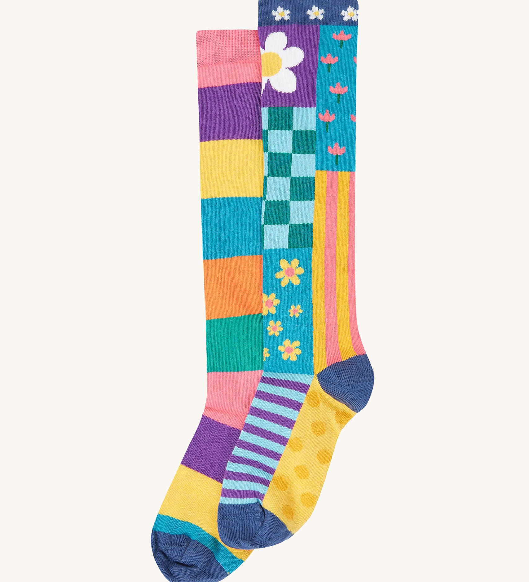Frugi kids hygge high knee socks in patchwork available at Babipur. 100% GOTS organic cotton knee high 2 pack socks. Features a pastel inspired striped and floral inspired design sock.