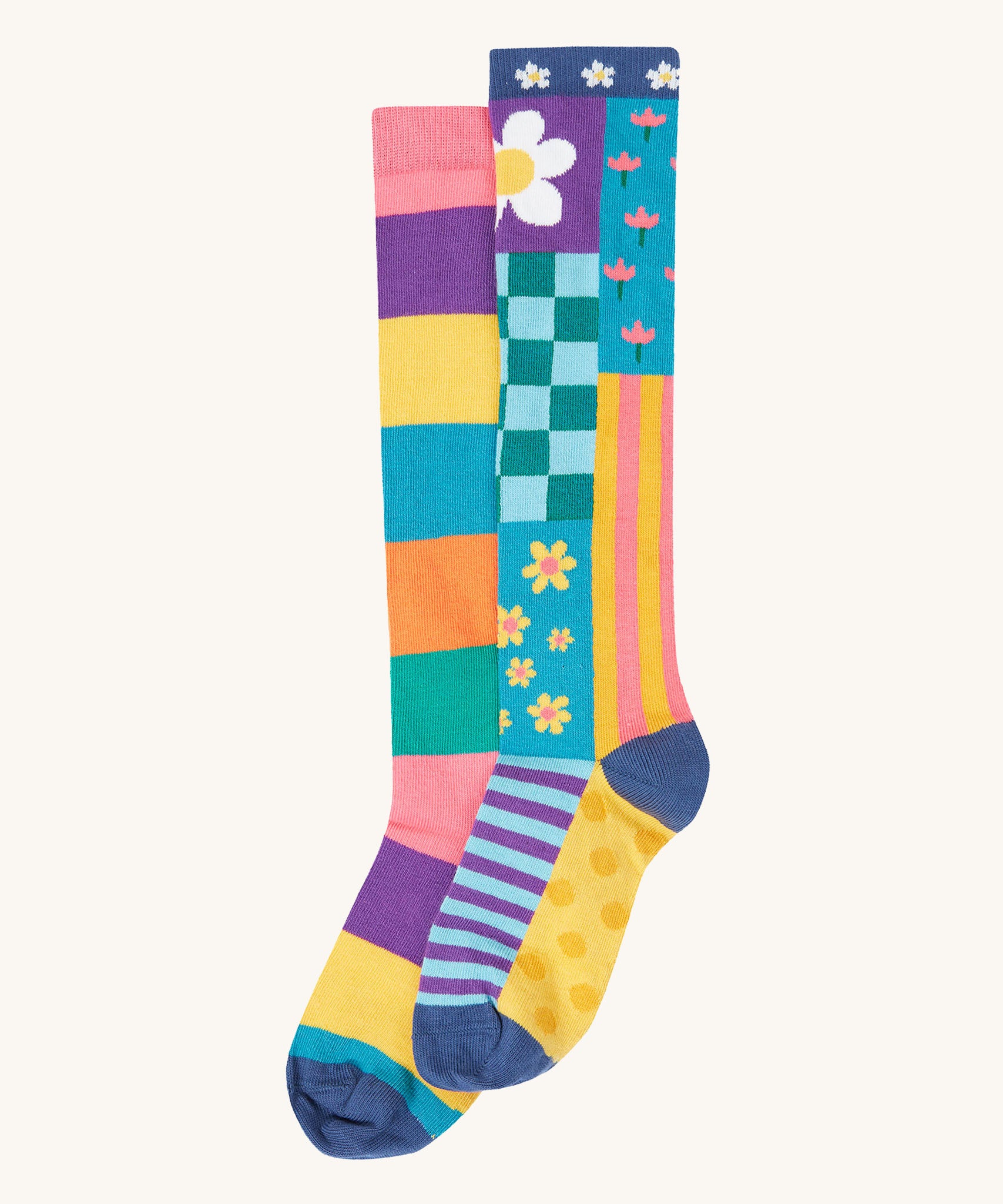 Frugi kids hygge high knee socks in patchwork available at Babipur. 100% GOTS organic cotton knee high 2 pack socks. Features a pastel inspired striped and floral inspired design sock.