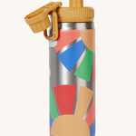 Frugi kids Insulated bottle in rainbow sun with the yellow cap opened. 