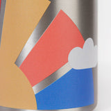 A close up of the Frugi kids Insulated bottle showing the print of a sun with rainbow rays on the stainless steel bottle
