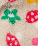 A close up of the thick cream fleece from the Frugi kids Autumn stripe/navy 3 in 1  waterproof rambler coat showing the flower and mushroom detail