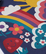 A close up of the Frugi kids kari dress in navy/rainbow showing the playful woodland inspired print detail on organic cotton fabric.