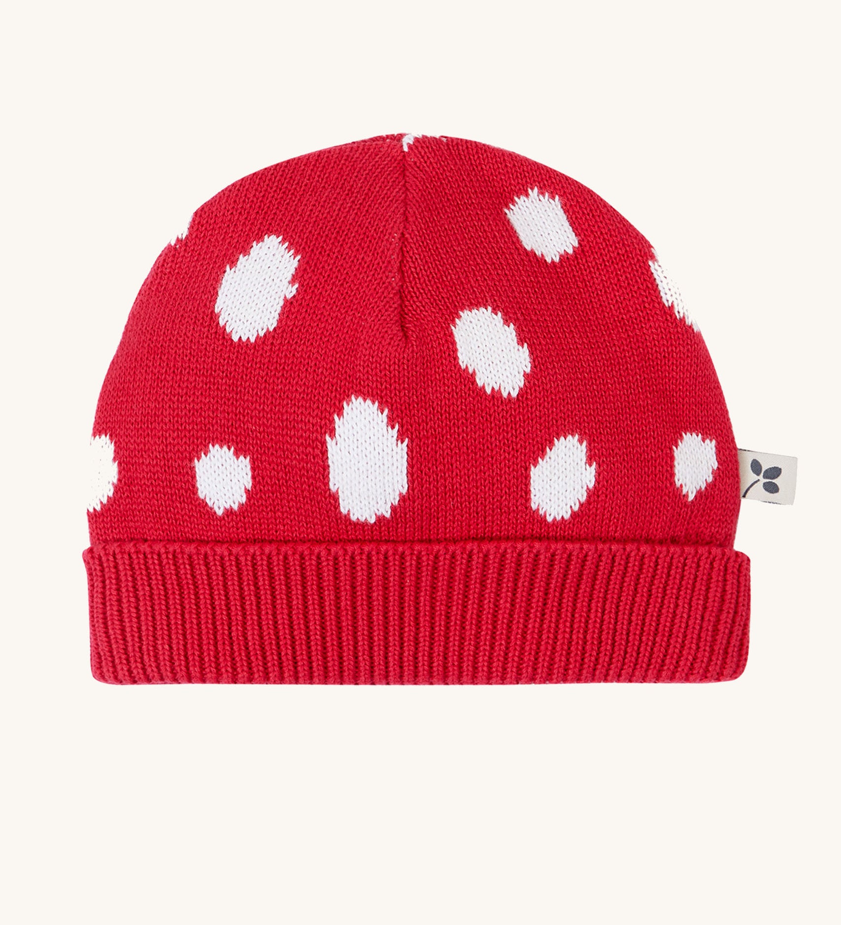 Frugi kids noa knitted hat in red mushroom available at Babipur. A 100% organic cotton soft knitted hat in bright red with white sports with a ribbed turned up brim.