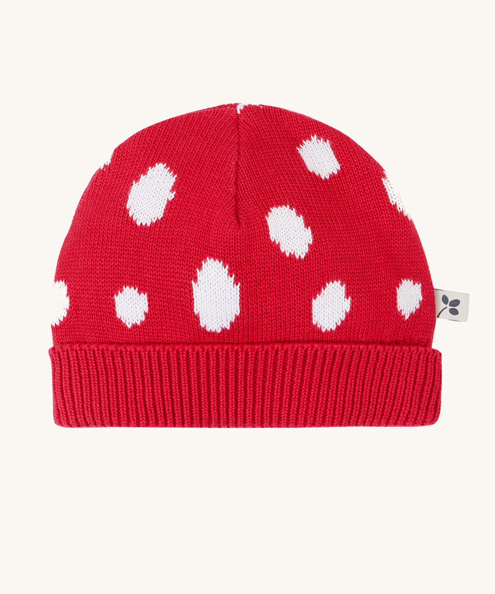 Frugi kids noa knitted hat in red mushroom available at Babipur. A 100% organic cotton soft knitted hat in bright red with white sports with a ribbed turned up brim.