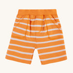 Frugi Organic Little Ellis Shorts - Tangerine Breton Stripe. A super soft organic cotton shorts in bright tangerine orange and white Breton stripes, and a comfy elasticated waistband with two handy pockets, on a cream background