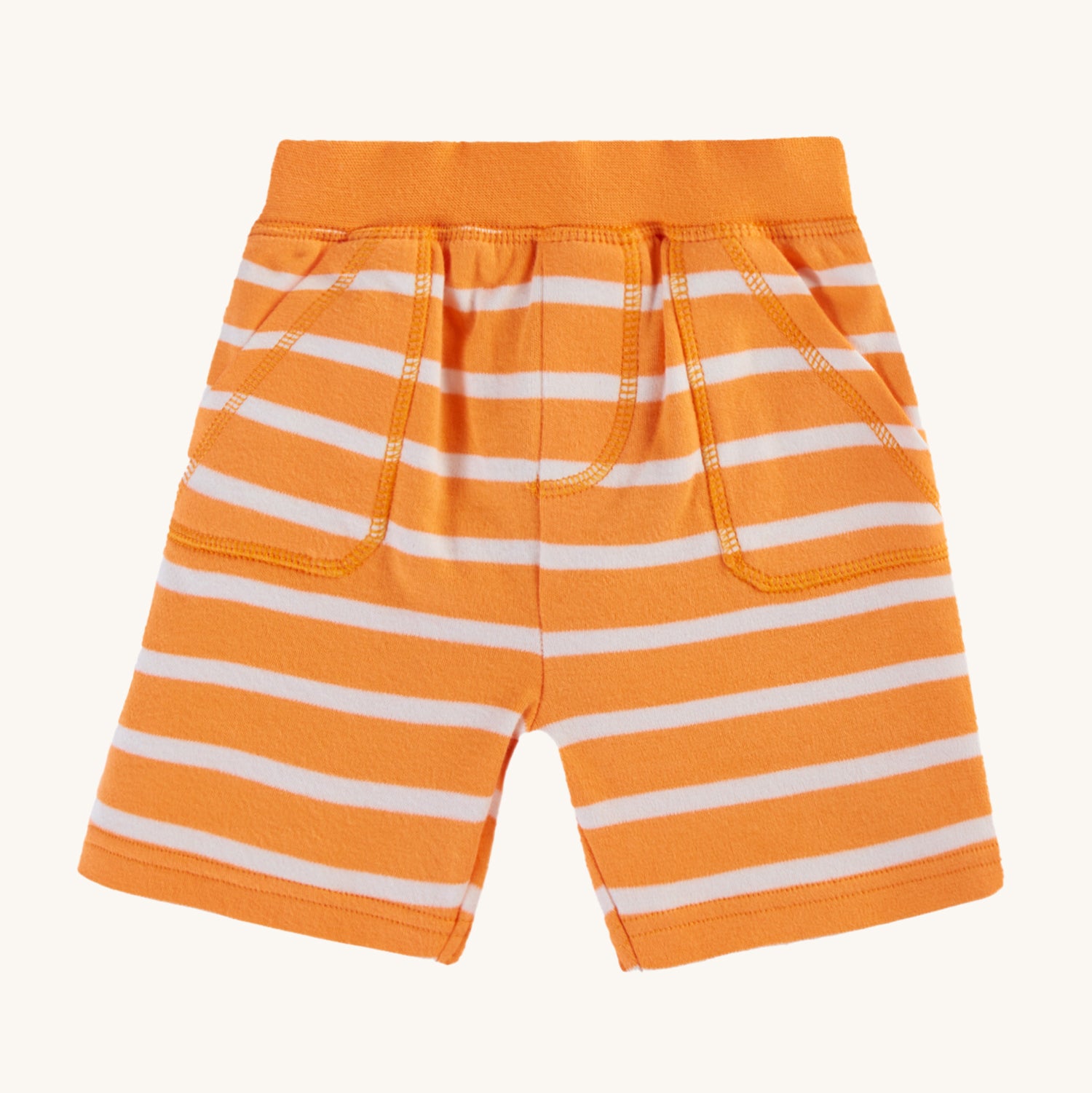 Frugi Organic Little Ellis Shorts - Tangerine Breton Stripe. A super soft organic cotton shorts in bright tangerine orange and white Breton stripes, and a comfy elasticated waistband with two handy pockets, on a cream background