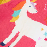 Close up of the unicorn on the back of the Frugi organic cotton cammie cardigan with a hotchpotch unicorn design. The unicorn has a colourful mane and colourful stars on it's body.