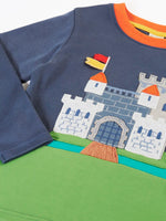 Close up of the details on the castle applique on the Frugi childs organic cotton terrific long sleeve navy top.