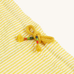  made from GOTS organic Cotton on a cream background.