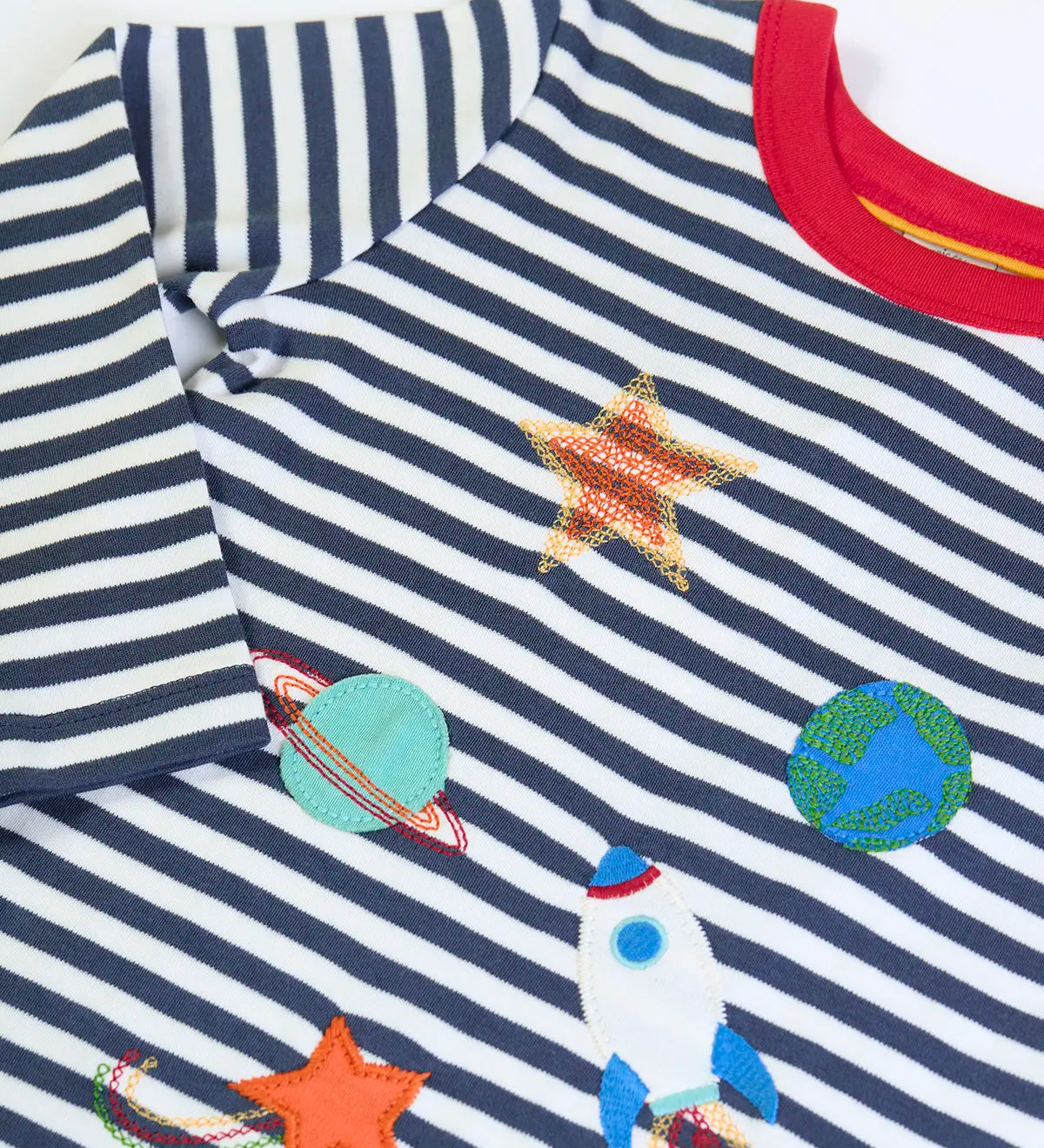 Frugi GOTS 100% organic cotton kids long sleeve top in navy and white stripes and space themed appliques on the front. 