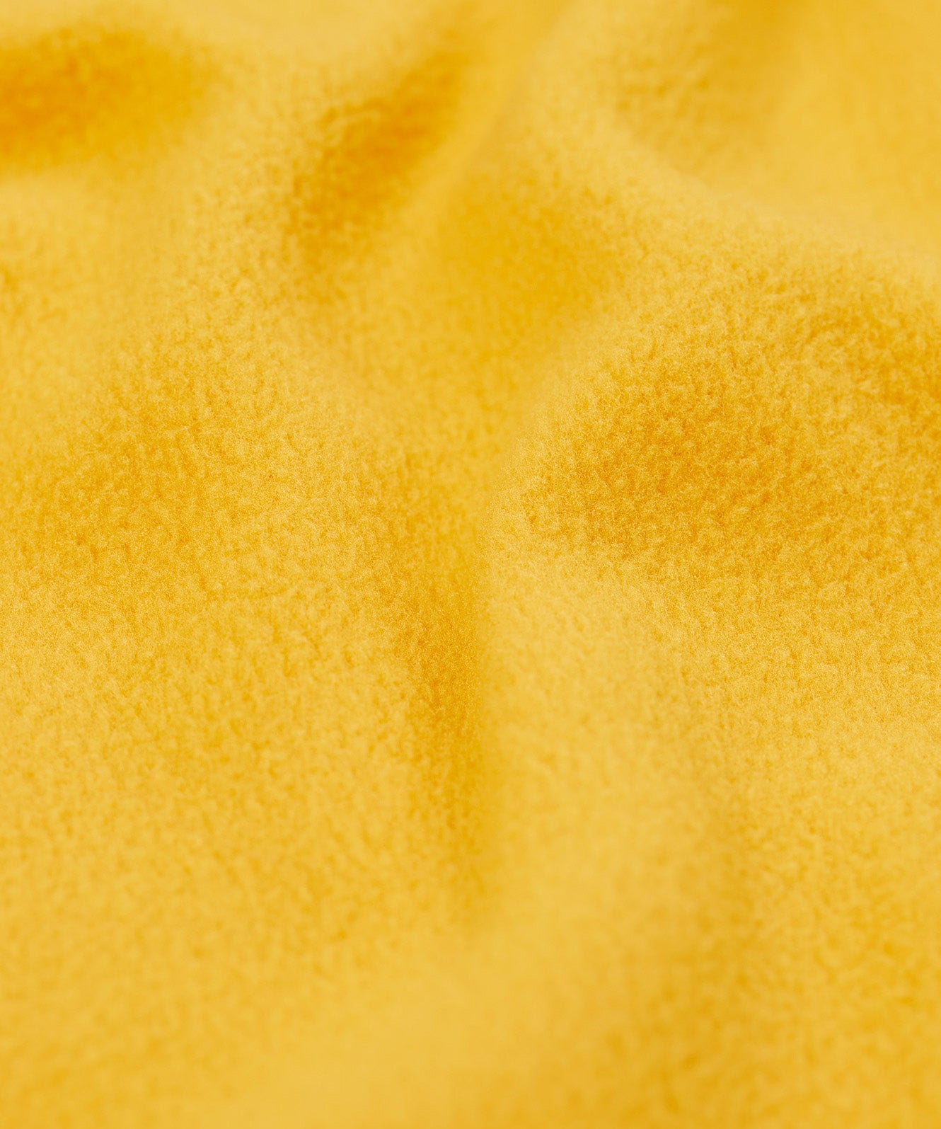 A close up of the yellow fleece liner from the Frugi panda play puddle buster waterproof all in one. 