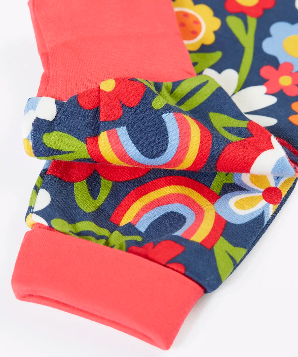 Frugi organic cotton piper printed parsnip jogger with a beautiful bunch floral print showing close up of the pink cuffs