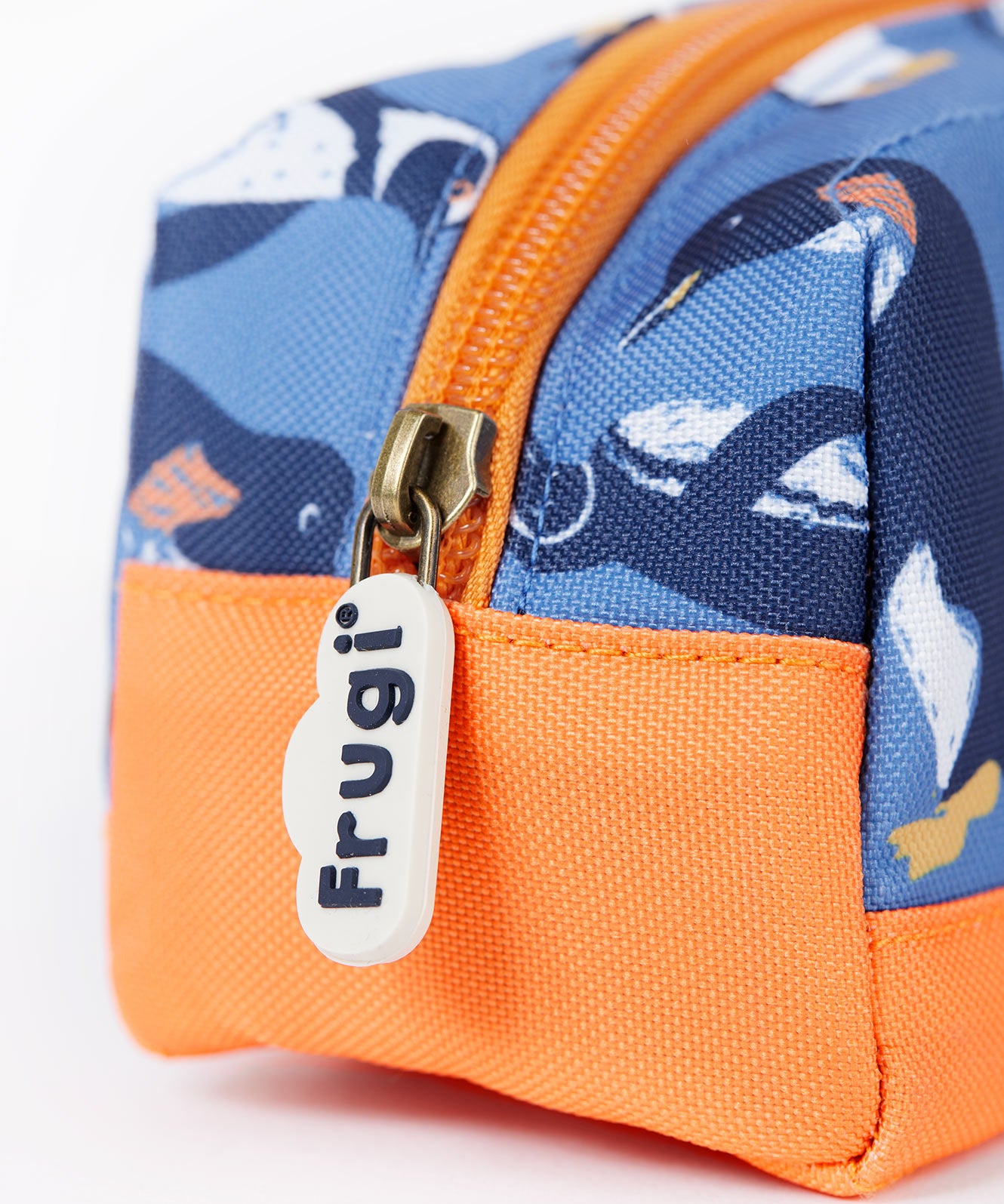 A close up of the Frugi penguin waddle pencil case. Showing the orange trim and zip detail