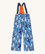 Frugi kids snow and ski salopettes in penguin waddle. A blue recycled polyester waterproof salopettes with waddling penguins. Features removable straps and bib.