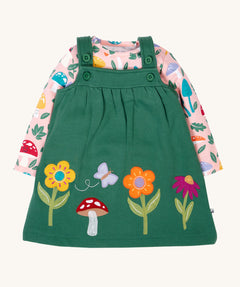 Frugi kids pippa holly green fun guys pinafore outfit available at Babipur. a 100% GOTs organic cotton outfit. Features a pink long sleeve top with cute woodland inspired prints and a green pinafore with flowers, mushroom and a bee applique 