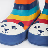 A close up of the bottom of the Frugi kids puddle buster wellington boots. Showing the the navy trim and playful panda print detail on multicoloured natural rubber material.