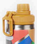 A close up of the Frugi kids Insulated bottle in rainbow sun. Showing the yellow cap with loop detail. 
