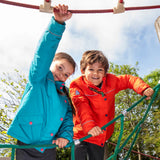 Two children wearing the Frugi kids 3 in 1 rambler coats, one in fire orange , one in boat blue.