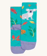 A close up of the Frugi koala rock my socks. A bright blue sock with a grey koala print on the front with coloured leaves. Features a light purple heel and toe contrast panel on organic cotton fabric