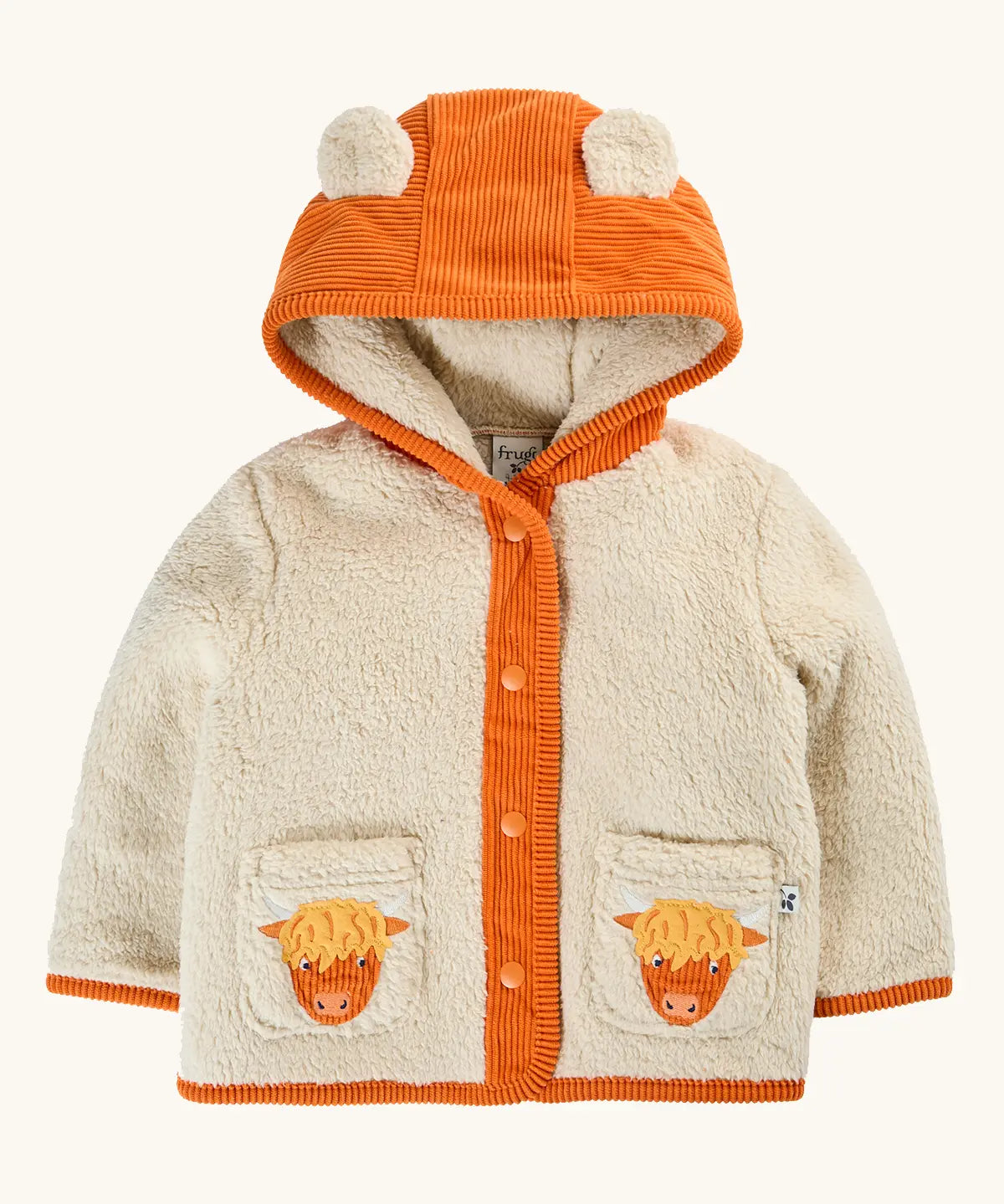 A frugi baby hooded cardigan jacket in cream sherpa with an orange corduroy hood, trim, and front placket. The hood has two cow ears, and the front pockets feature embroidered Scottish Highland cow faces.